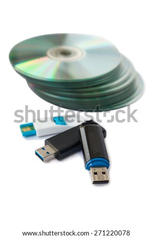 Usb flash drives and CDs isolate on white background.