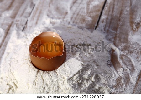 Chopped egg in bunch of flour closeup copyspace, horizontal picture