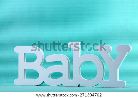 Word baby on blue background