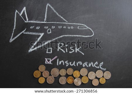 Art work of a plane with risk concept. Risk and insurance is written on blackboard which white color chalk. Different countriesÃ¢Â?Â? currencies are here to show the value of travel.   