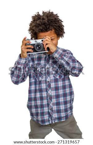 Little boy shooting on camera.