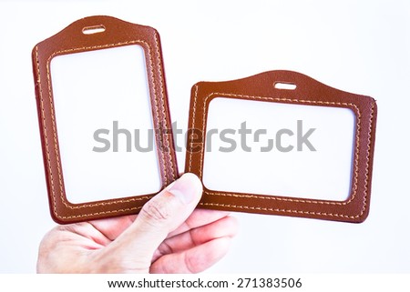 Brown leather label tag with string, isolated on the white background.