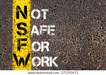 Business Acronym NSFW as NOT SAFE FOR WORK. Yellow paint line on the road against asphalt background. Conceptual image Royalty-Free Stock Photo #271393472