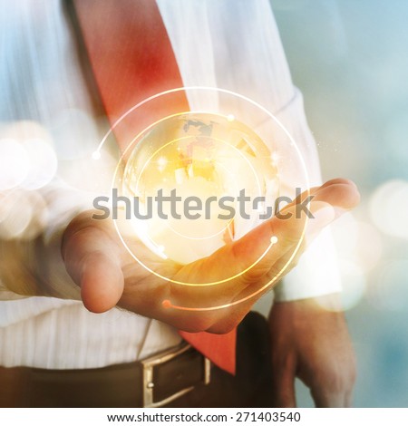 Businessman holding earth