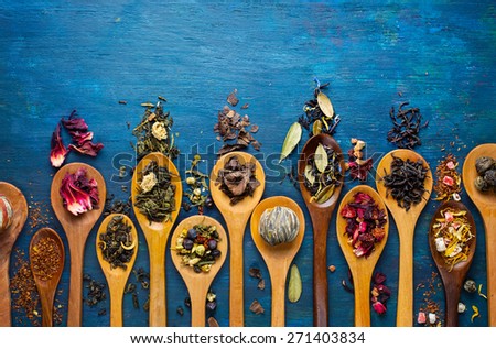 Dry tea with in wooden spoons. Top view Royalty-Free Stock Photo #271403834