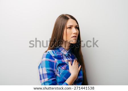 woman holding hands on his chest