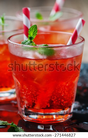 Red Cocktail with mint and ice, selective focus
