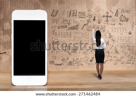 woman shows drawn infographics and smartphone with a blank screen