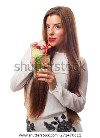 elegant woman drinking a mojito