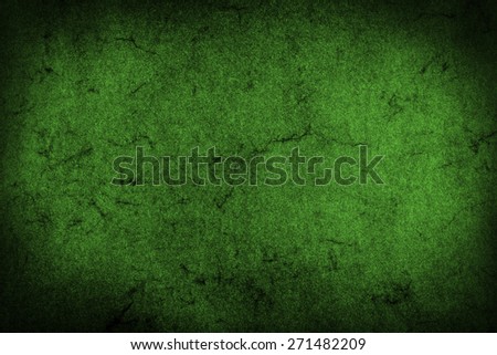 Green grunge textured wall. Dark edges. Advertising copy space