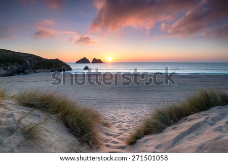 Sunset through the sand dunes at Holywell Bay near Newquay in Cornwall Royalty-Free Stock Photo #271501058
