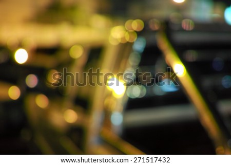 Beautiful defocused city night filtered bokeh abstract with car background.