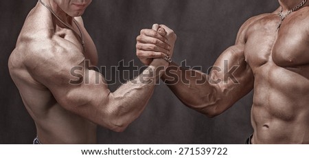 Hello athletes. Two bodybuilder shake hands