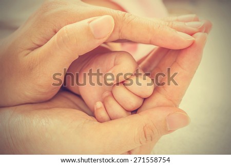 New born baby hand - vintage effect style pictures
