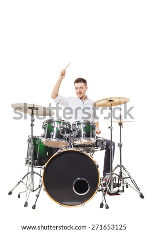 Handsome guy behind the drum kit on a white background in shirt and trousers Royalty-Free Stock Photo #271653125