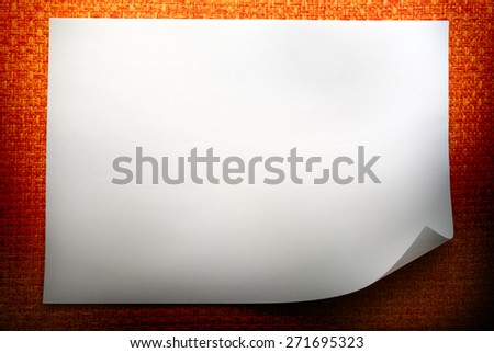 Blank sheet of paper on orange background