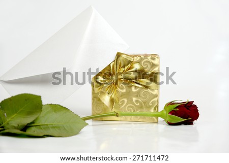 Present with letter and red rose