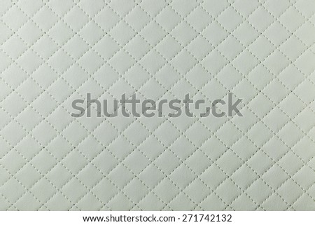 detail of white sewn leather