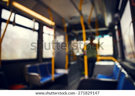 Blurred blurry soft focus background, interior of empty bus with nobody in it