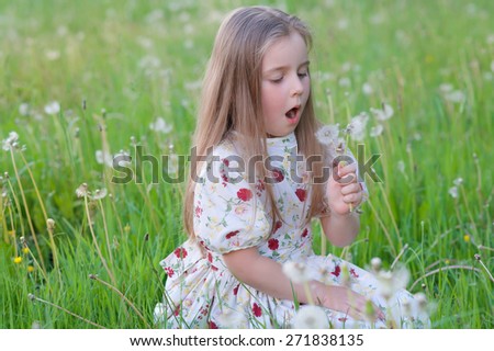 Beautiful, young girl with dandelions