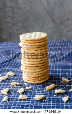 Stack of crackers on blue table