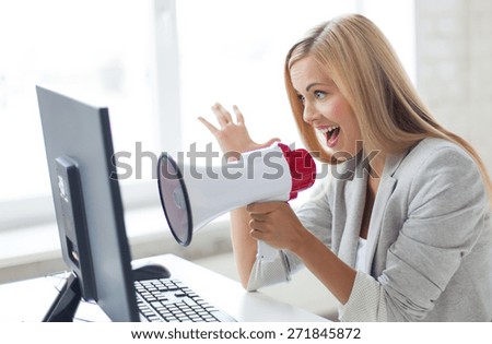 picture of crazy businesswoman shouting in megaphone