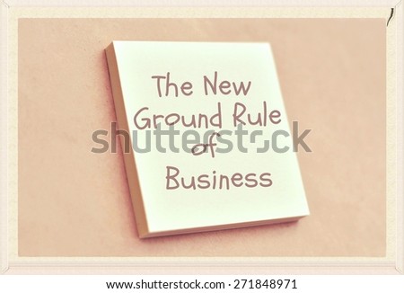 Text the new ground rule of business on the short note texture background