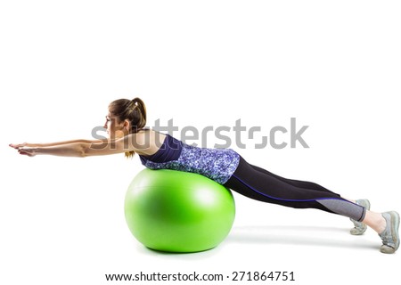 Fit woman exercising on exercise ball on white background
