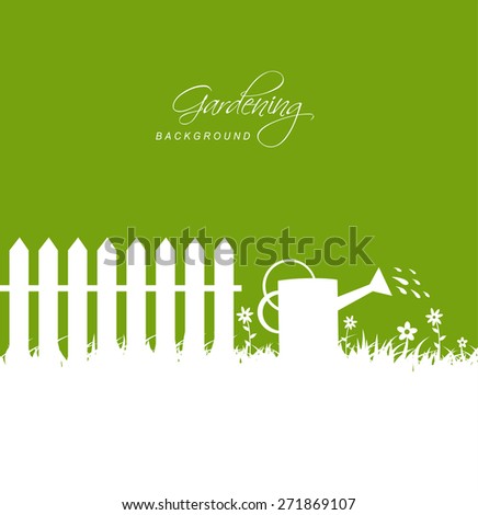 Gardening scene with watering can near fence on grass