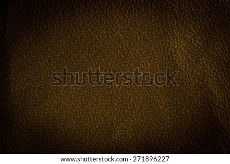Grungy old textile or leather background. Colorful texture useful as background