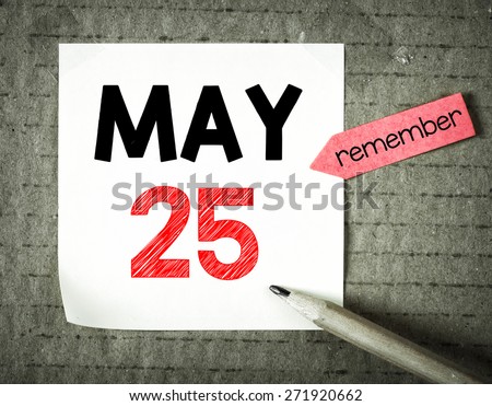 Note with 25 may and pencil on grunge background