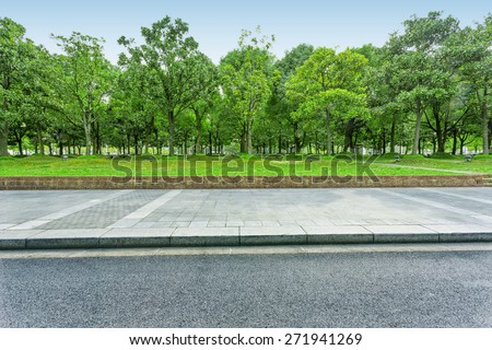 urban road with green trees Royalty-Free Stock Photo #271941269