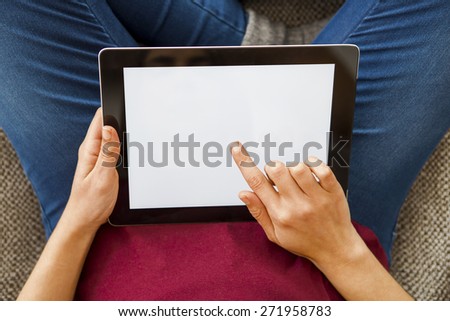 Cropped shot of female hands working with a tablet, tablet with copy space 