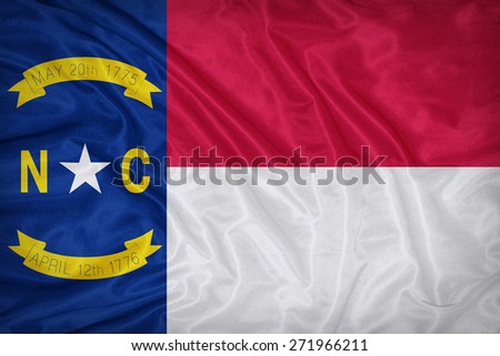 North Carolina flag on fabric texture,retro vintage style