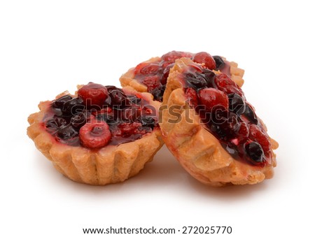 Three cupcake with raspberry and cherry.