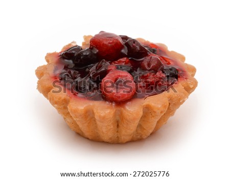 Cupcake with raspberry and cherry isolated on white.