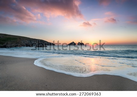 Dramatic sunset at Holywell Bay, a large sandy beach near Newquay in Cornwall Royalty-Free Stock Photo #272069363