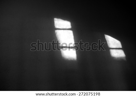 The abstract light from windows and hatches on the walls of a niche / Light shines through the windows