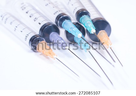 Syringe with droplet and medical on white background.
