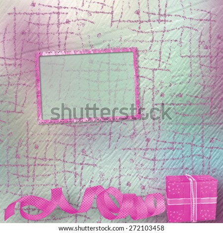 Gift box in pink wrapping paper on vintage cardboard background with frames