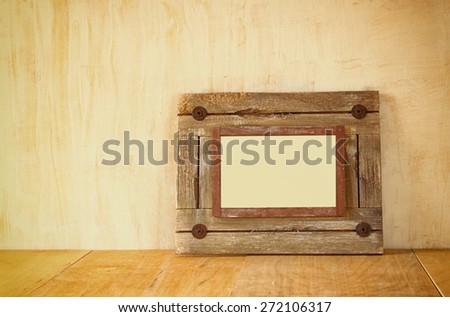 photo of old nautical wooden frame on wooden table