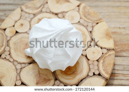 Creamy white bizet cookies on wooden table