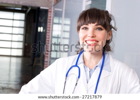 Female doctor hands on hips in a modern office