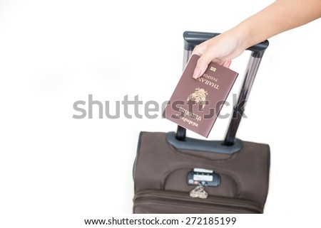Hand holding passport isolated.