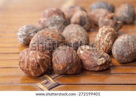 shea nuts near butter, isolated on white background