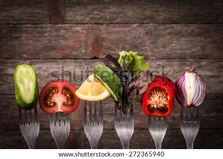 Fresh mixed vegetables on fork  