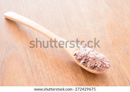 Spoon of organic berry jusmine rice, stock photo
