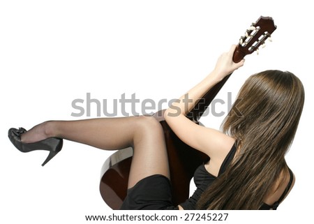Back view of a girl with a spanish guitar