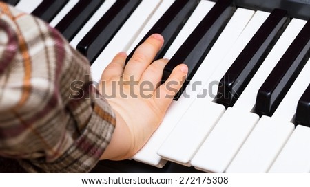 Close up of Keyboard of synthesizer. Music abstract background with hands playing on keyboard.