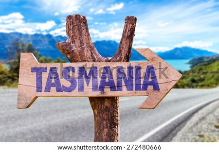 Tasmania wooden sign with road background